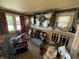 Spacious carpeted living room with a decorative fireplace and large mantel at 2811 Fenwood Ave, Terre Haute, IN 47803