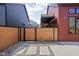 Stylish backyard with wood fence, gravel landscaping, stone pavers, and modern home exteriors at 1676 Solebar Way, Westfield, IN 46074