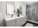 Modern bathroom with double vanity, quartz countertop, gold fixtures, and walk-in shower with tile at 1676 Solebar Way, Westfield, IN 46074