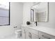 Bright bathroom features a modern vanity with quartz counters and gold hardware plus a framed mirror at 1676 Solebar Way, Westfield, IN 46074