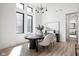 Elegant dining room with a modern chandelier, stylish chairs, and bright natural light at 1676 Solebar Way, Westfield, IN 46074