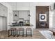 Modern kitchen with sleek black countertops, gray cabinetry, and a cozy breakfast bar at 1676 Solebar Way, Westfield, IN 46074
