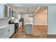 Open concept kitchen with stainless appliances, subway tile backsplash, and grey kitchen island at 1229 N Keystone Ave, Indianapolis, IN 46201