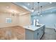 Kitchen with island seating, stainless steel appliances, and hardwood floors at 1229 N Keystone Ave, Indianapolis, IN 46201