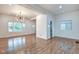 Hardwood floors in a living room with lots of natural light from large windows at 1229 N Keystone Ave, Indianapolis, IN 46201