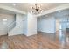 Open-concept living room featuring hardwood floors and staircase at 1229 N Keystone Ave, Indianapolis, IN 46201