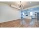 Bright and large living room with hardwood floors and access to the modern kitchen at 1229 N Keystone Ave, Indianapolis, IN 46201