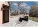 Outdoor dining area with a wood deck and view to the backyard at 10909 Wonderland Dr, Indianapolis, IN 46239