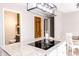 Bright kitchen features a modern island with granite counters and an induction cooktop at 10909 Wonderland Dr, Indianapolis, IN 46239