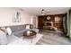 Comfortable living room with a gray sectional sofa, fireplace, and hardwood flooring at 10909 Wonderland Dr, Indianapolis, IN 46239