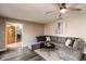 Cozy living room with a large gray sectional sofa and hardwood floors at 10909 Wonderland Dr, Indianapolis, IN 46239