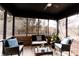 Relaxing screened patio with comfortable seating and a view of the backyard at 10909 Wonderland Dr, Indianapolis, IN 46239