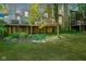 Spacious backyard with deck, landscaping, and partial view of neighboring homes at 4695 Shireton Ct, Indianapolis, IN 46254