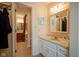 Cozy bathroom features a vanity with sink, a tub with shower, and neutral décor creating a relaxing atmosphere at 4695 Shireton Ct, Indianapolis, IN 46254