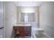 Bathroom with tub, vanity, and wood cabinets at 4695 Shireton Ct, Indianapolis, IN 46254