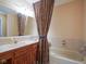 Bathroom with a vanity, sink, and a bathtub with a shower curtain at 4695 Shireton Ct, Indianapolis, IN 46254