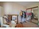 Bedroom featuring a comfortable chair, full length mirrors and carpet flooring at 4695 Shireton Ct, Indianapolis, IN 46254
