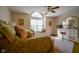Spacious bedroom features a unique window seat, ceiling fan, and complementing decor, creating a cozy and inviting space at 4695 Shireton Ct, Indianapolis, IN 46254