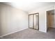 Bedroom with mirrored closet doors and carpet at 4695 Shireton Ct, Indianapolis, IN 46254
