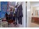 Walk-in closet with clothing racks, shelves, and access to the bathroom at 4695 Shireton Ct, Indianapolis, IN 46254