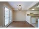 Dining area with hardwood floors and French doors leading to patio at 4695 Shireton Ct, Indianapolis, IN 46254