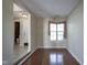 Simple dining room with hardwood floors and access to bathroom and kitchen at 4695 Shireton Ct, Indianapolis, IN 46254