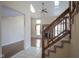 Bright entryway with tile floors and staircase leading to upper level at 4695 Shireton Ct, Indianapolis, IN 46254