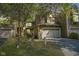 Evening view of charming two-story home with attached two-car garage and landscaped yard at 4695 Shireton Ct, Indianapolis, IN 46254