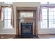 Ornate wooden fireplace with a mirror above the mantle at 4695 Shireton Ct, Indianapolis, IN 46254