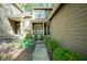 Inviting front entrance with charming porch, manicured bushes, and elegant architectural details at 4695 Shireton Ct, Indianapolis, IN 46254