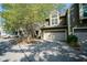 Exterior view of a well-maintained home featuring a two-car garage and mature landscaping at 4695 Shireton Ct, Indianapolis, IN 46254