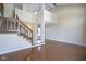 Two-story living room with hardwood floors, staircase, and high ceilings at 4695 Shireton Ct, Indianapolis, IN 46254