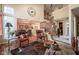 Open-concept living area with high ceilings, fireplace, and staircase leading to the second floor at 4695 Shireton Ct, Indianapolis, IN 46254