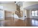 Open living space showcasing hardwood floors, staircase, and natural light at 4695 Shireton Ct, Indianapolis, IN 46254