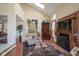 Bright living room featuring vaulted ceilings, fireplace, and comfortable seating area with eclectic decor at 4695 Shireton Ct, Indianapolis, IN 46254