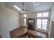 Spacious living room with hardwood floors, fireplace, and large windows at 4695 Shireton Ct, Indianapolis, IN 46254