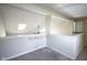 Spacious loft area with skylight and ceiling fan at 4695 Shireton Ct, Indianapolis, IN 46254