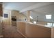 Loft area with built-in shelving and a view of the main floor at 4695 Shireton Ct, Indianapolis, IN 46254