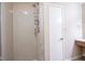 Clean shower stall with glass enclosure and storage shelves at 4695 Shireton Ct, Indianapolis, IN 46254