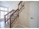 Wooden staircase with carpeted steps and wooden railing at 4695 Shireton Ct, Indianapolis, IN 46254