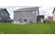 Spacious backyard featuring a well-maintained lawn and a charming seating area, perfect for outdoor gatherings at 1130 Cobra Dr, Franklin, IN 46131