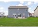 Spacious backyard featuring a well-maintained lawn and a charming seating area, perfect for outdoor gatherings at 1130 Cobra Dr, Franklin, IN 46131