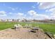 Scenic backyard with a gravel area, complete with chairs and a lovely view of the lake and neighborhood at 1130 Cobra Dr, Franklin, IN 46131