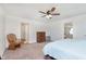 Light-filled bedroom featuring neutral carpet and furnishings, adjoining Primary bath and closet at 1130 Cobra Dr, Franklin, IN 46131