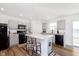 Stylish kitchen with a center island, sleek gray cabinets, and modern black appliances at 1130 Cobra Dr, Franklin, IN 46131