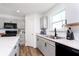 Bright kitchen featuring gray cabinetry, modern black fixtures, stainless sink and plenty of natural light at 1130 Cobra Dr, Franklin, IN 46131