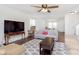Comfortable living room with modern furnishings, a ceiling fan, and wood-look flooring at 1130 Cobra Dr, Franklin, IN 46131