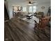 Open-concept living room flows seamlessly to the dining area with lovely backyard views at 1130 Cobra Dr, Franklin, IN 46131