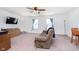 Spacious living room with neutral carpet, a recliner, and bright windows at 1130 Cobra Dr, Franklin, IN 46131