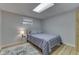 Basement bedroom with a full-size bed and striped bedding at 7438 Haw Dr, Nineveh, IN 46164